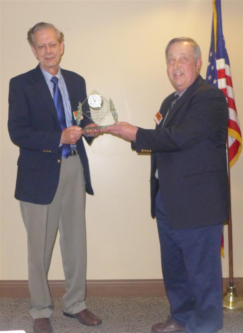 Del Malzahn presents Clayton Award to Hank Muranko